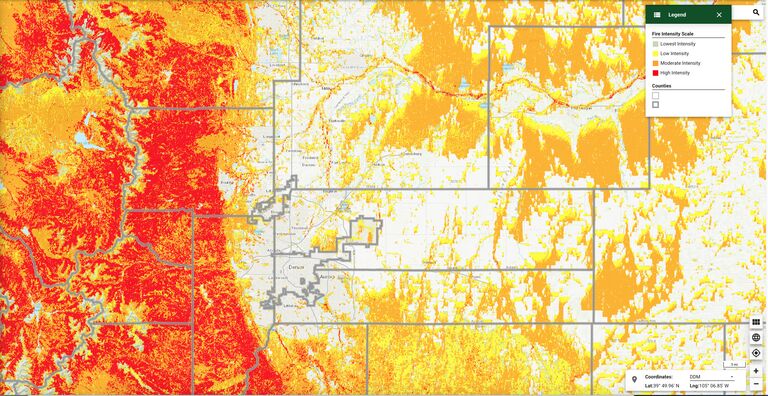 Colorado Wildfire Risk Viewer map of the Denver metro area and Front Range, with fire intensity shaded from lowest (green) to high (red)